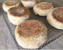 There’s something incredibly satisfying about making your own homemade English muffins from scratch — especially when they turn out soft, fluffy, golden, and far superior to anything you can buy at the supermarket. These Thermomix English Muffins are made with simple pantry staples, contain no preservatives, and deliver that classic bakery-style texture with perfect nooks and crannies every single time. If your household goes through packs of store-bought muffins each week, this easy Thermomix bread recipe will quickly become a staple in your kitchen. Once you taste the difference in flavor and freshness, you may never go back to packaged versions again. Perfect for breakfast, brunch, or even a light dinner, these muffins are incredibly versatile. Toast them and top with scrambled eggs, smashed avocado, crispy bacon, poached eggs for Eggs Benedict, or simply spread with butter and jam. They’re equally delicious with peanut butter, honey, or even a savory spread. And the best part? This is a straightforward Thermomix dough recipe that handles most of the work for you. Why Homemade English Muffins Are Worth It 1. No Artificial Additives or Preservatives When you make your own English muffins, you know exactly what goes into them. There are no hidden ingredients, stabilizers, or artificial preservatives — just wholesome basics. 2. Simple, Everyday Ingredients This recipe uses common baking staples you likely already have in your pantry and fridge. 3. Incredible Texture These muffins are thick, soft, and lightly crisp on the outside when toasted — exactly what you want in a traditional English muffin. 4. Budget-Friendly Making your own baked goods at home can significantly reduce grocery costs over time. 5. Freezer Friendly Batch baking means you can freeze extras and toast them straight from frozen for busy mornings. 6. Suitable for All Thermomix Models Whether you own a TM31, TM5, TM6, or earlier version, this recipe works beautifully. What Makes These English Muffins So Fluffy? The secret to achieving soft, airy muffins lies in: Proper yeast activation Using full-fat milk for richness Adequate kneading time Allowing the dough to rise fully (twice!) Keeping the dough thick when rolling The double-rise method ensures the muffins develop structure and that classic interior texture English muffins are famous for. Ingredient Guide: Understanding Each Component Here’s a breakdown of the ingredients used in this easy Thermomix English muffin recipe and why they matter. Dried Active Yeast (or Fresh Yeast) Yeast is essential for creating lift and fluffy texture. Individually sealed 7g sachets are ideal because they stay fresh and active. If using fresh yeast, ensure it is within date and stored correctly. Full-Fat Milk Using full cream milk enhances both flavor and texture. The natural fat contributes to a softer crumb and richer taste. Caster Sugar (Superfine Sugar) Sugar feeds the yeast and helps activate fermentation while also adding subtle sweetness. Butter (Salted or Unsalted) Butter adds tenderness and improves overall flavor. Room temperature butter incorporates more easily into the dough. Egg A large egg helps bind the dough, adds moisture, and improves structure. Bread Flour (Preferred) or Plain Flour Bread flour produces the best results because of its higher protein content, creating stronger gluten structure and better rise. However, plain flour works perfectly well if that’s what you have available. Sea Salt Salt balances flavor and strengthens gluten development. Semolina (or Polenta) Semolina prevents sticking and gives that classic slightly textured base found in traditional English muffins. Step-by-Step Method: Making English Muffins in the Thermomix Step 1 – Activate the Yeast Mixture Begin by placing the milk, yeast, and sugar into a clean Thermomix bowl. Gently heat to activate the yeast. This step ensures proper fermentation and guarantees a successful rise. You’ll know it’s working when the mixture looks slightly frothy. Step 2 – Combine the Dough Ingredients Add butter, egg, salt, and flour to the bowl. Mix until the ingredients come together into a sticky dough. Don’t worry — this dough is naturally soft and slightly tacky. Step 3 – Knead for Structure Use the Thermomix kneading function to develop gluten. Proper kneading is crucial for that fluffy interior texture. The dough will still feel sticky — that’s normal and exactly how it should be. Step 4 – First Rise (Bulk Fermentation) Transfer the dough into a lightly greased bowl or ThermoServer. Cover and place in a warm, draft-free area. Allow it to rise for about one hour, or until doubled in size. Best Places to Proof Dough: Inside an oven that has been briefly warmed then turned off Near a sunny window On top of a warm appliance Wrapped in a towel in a warm room Avoid overheating, as too much heat can kill the yeast. Step 5 – Shape the Muffins Sprinkle semolina over a clean surface. Turn out the risen dough and gently roll it to approximately 2–3 cm thick. Using a round cutter (around 9 cm), cut out thick circles. Avoid rolling too thin — thickness ensures a proper rise and fluffy interior. You should get about 8 muffins. Step 6 – Second Rise Place the rounds onto a semolina-dusted tray lined with baking paper. Let them rest for about 20 minutes. They will puff slightly during this time. This second proof helps develop lightness and improves final texture. Step 7 – Pan Cook to Golden Perfection Unlike traditional oven-baked bread, English muffins are par-cooked in a frying pan or griddle. Heat a pan over medium heat and sprinkle lightly with semolina. Cook each muffin for 5–8 minutes per side until golden brown and cooked through. They should feel firm but still soft. How to Serve English Muffins Once cooled, slice them in half and toast before serving. Top with: Butter and strawberry jam Scrambled eggs and bacon Smashed avocado and feta Eggs Benedict with hollandaise sauce Peanut butter and honey They are perfect for breakfast meal prep, brunch gatherings, or quick weekday meals. Storage & Freezing Instructions Room Temperature Store in an airtight container for up to 3 days. Freezer Freeze for up to 3 months. When ready to eat: Defrost slightly Slice in half Toast until golden Freezing makes this one of the best make-ahead breakfast bread recipes. Frequently Asked Questions How Are English Muffins Cooked? They are cooked in a frying pan rather than baked in the oven, which gives them their signature texture. Can I Double the Recipe? It’s not recommended unless you have a very large proofing container, as the dough expands significantly. Is Semolina the Same as Polenta? No, but they are similar enough that either can be used for dusting. Nutritional Overview (Per Muffin Approx.) Calories: 326 kcal Carbohydrates: 56g Protein: 11g Fat: 6g Fiber: 2g Making your own Thermomix English muffins is one of the most rewarding baking projects you can try. With simple ingredients, easy steps, and unbeatable flavor, this recipe proves that homemade bread doesn’t need to be complicated. Once you experience warm, freshly toasted English muffins straight from your own kitchen, you’ll understand why homemade truly is best.